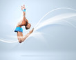 Young woman in gymnast suit posing