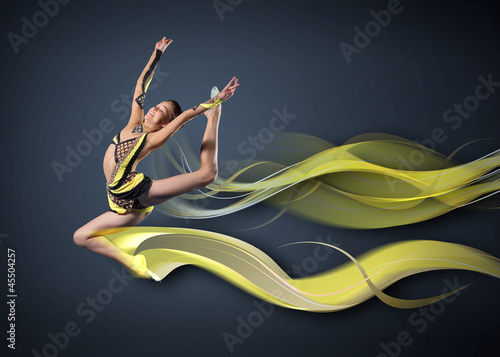 Photo: Young woman in gymnast suit posing Young woman in gymnast suit posing