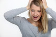 Stressed blond woman shouting