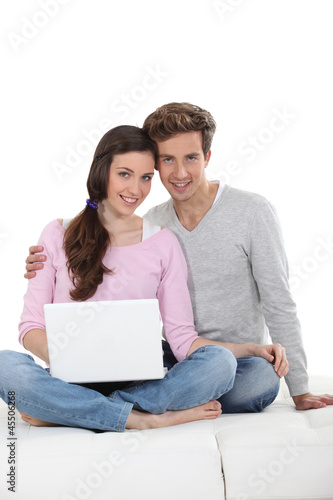 Photo: Young couple with a laptop Young couple with a laptop