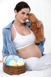 Pregnant woman knitting.
