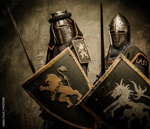 Photo: Medieval knights on grey background Medieval knights on grey background