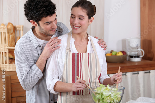 Photo: Couple preparing a salad together Couple preparing a salad together