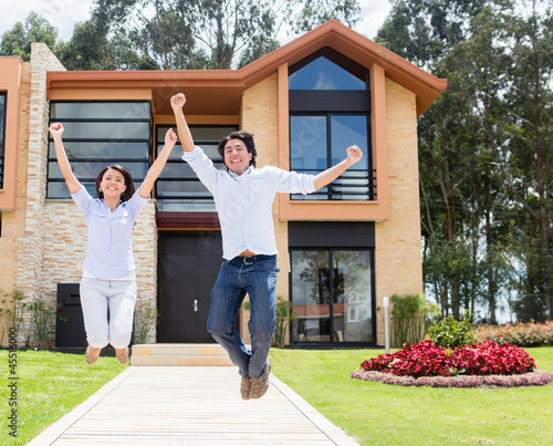Photo: Excited couple about their house Excited couple about their house