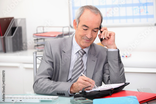 Photo: Businessman planning an appointment Businessman planning an appointment
