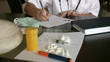 Female doctor writing prescription.
