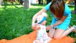 Happy Mother and her baby girl play outdoor