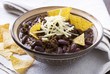 Chili con carne in cup with tortilla chips