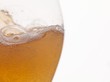 A glass of foamy cider