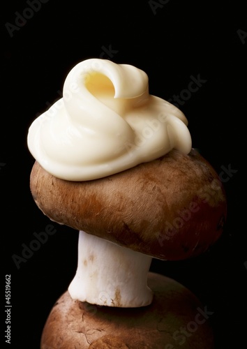 Photo: A brown mushroom with a dollop of mayonnaise A brown mushroom with a dollop of mayonnaise