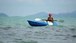 Woman kayaking at tropical sea