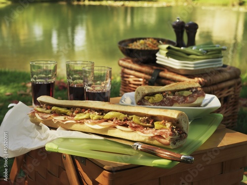 Photo: Picnic at the lake with Muffuletta (round Sicilian sesame bread) sandwiches Picnic at the lake with Muffuletta (round Sicilian sesame bread) sandwiches