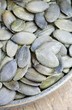 A bowl of pumpkin seeds (detail)