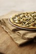 Thin Crust Pizza Topped with Chicken, Mushrooms, Onions and Pesto