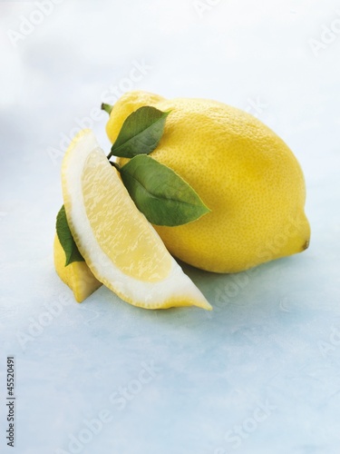 Photo: Whole lemon, lemon wedge and leaves Whole lemon, lemon wedge and leaves
