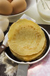 Piling up pancakes in frying pan