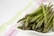 Green asparagus on tea towel