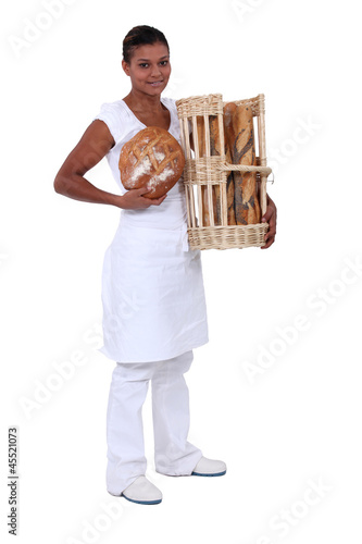 Photo: A black woman baker. A black woman baker.