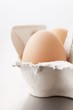 A hen's egg in an egg box
