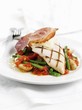 Chicken breast with Parma ham on green beans and tomatoes