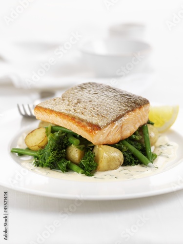 Photo: Salmon trout fillet on broccoli and potatoes Salmon trout fillet on broccoli and potatoes