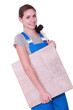 Woman with a floor tile and a mallet