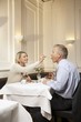 Mature couple enjoying dessert in a restaurant
