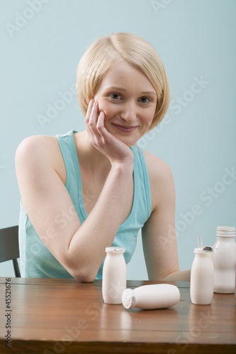 Photo: Young woman with milk drinks Young woman with milk drinks