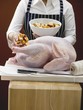 Stuffing turkey with bread cubes