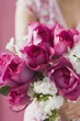 Woman holding bunch of summer flowers