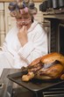 Despairing housewife with burnt turkey
