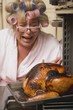 Despairing housewife with burnt turkey