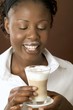 Woman drinking latte macchiato