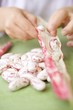 Child's hands shelling borlotti beans