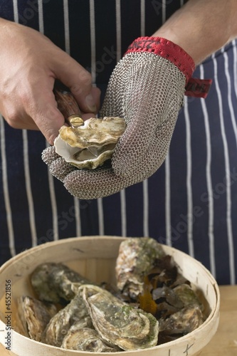 Photo: Shucking oysters Shucking oysters