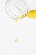 Olive oil dripping out of a bottle