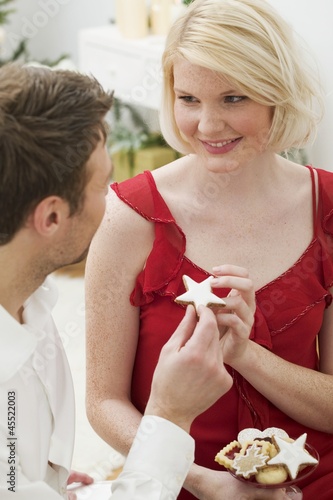 Photo: Man handing woman a cinnamon star Man handing woman a cinnamon star