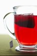 Glass Mug of Red Tea with Tea Bag