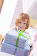 Little girl with Christmas parcels