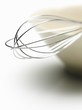 A whisk in a bowl