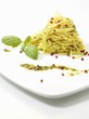 Spaghetti with pesto and pink peppercorns
