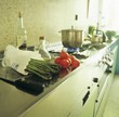 Green asparagus & tomatoes, pan on gas cooker in background