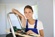 Cheerful young woman ready to reform house