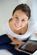 Upper view of young woman websurfing on internet