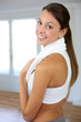 Portrait of cheerful woman exercising in gym