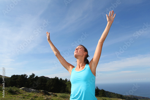 Photo: woman doing yoga exercises in countryside woman doing yoga exercises in countryside
