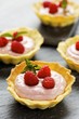 Several raspberry tarts