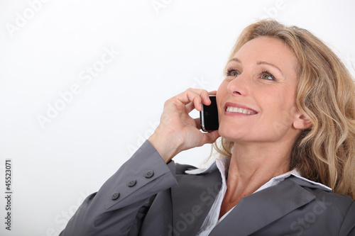 Photo: Woman on the phone Woman on the phone