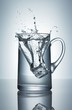 Ice cube falling into jug of water