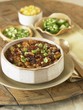 Bowl of Chili Con Carne with Assorted Toppings